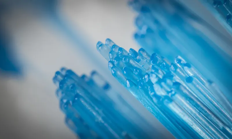 Close-up of blue toothbrush bristles, capturing intricate details and textures